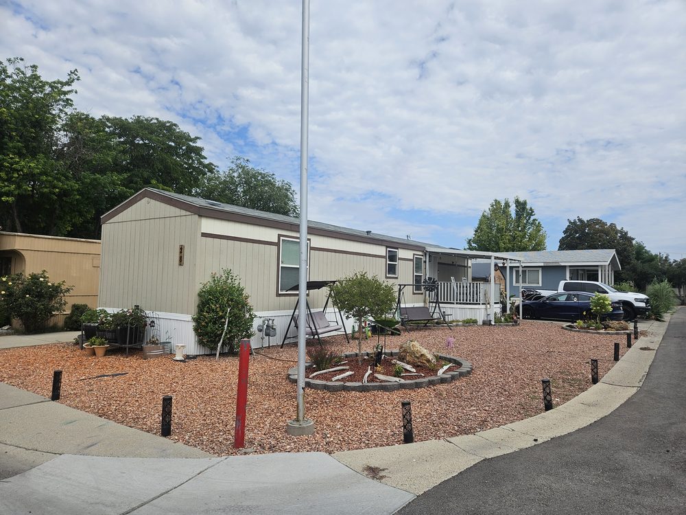 Manufactured home with landscaped rock garden